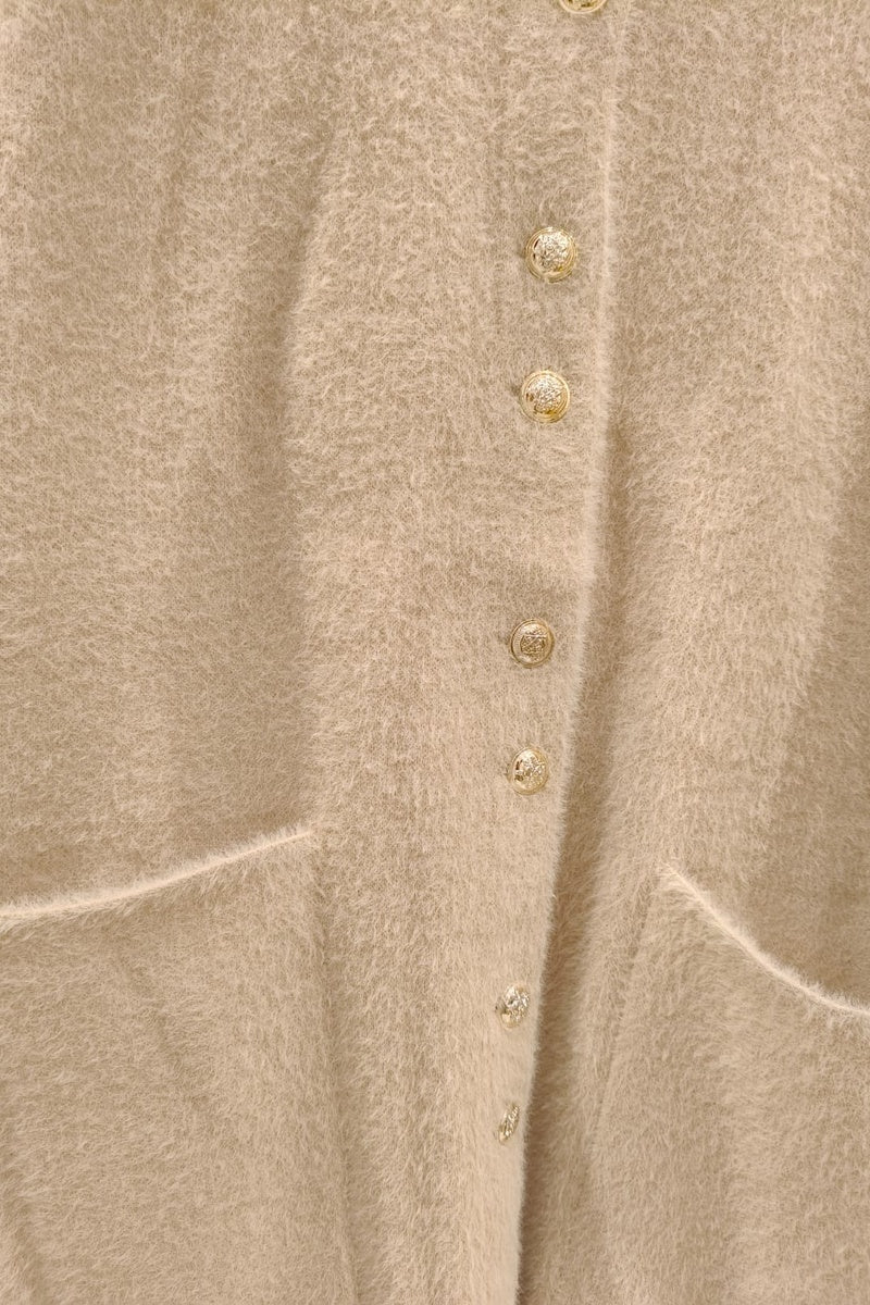 Manteau uni fausse fourrure avec poches