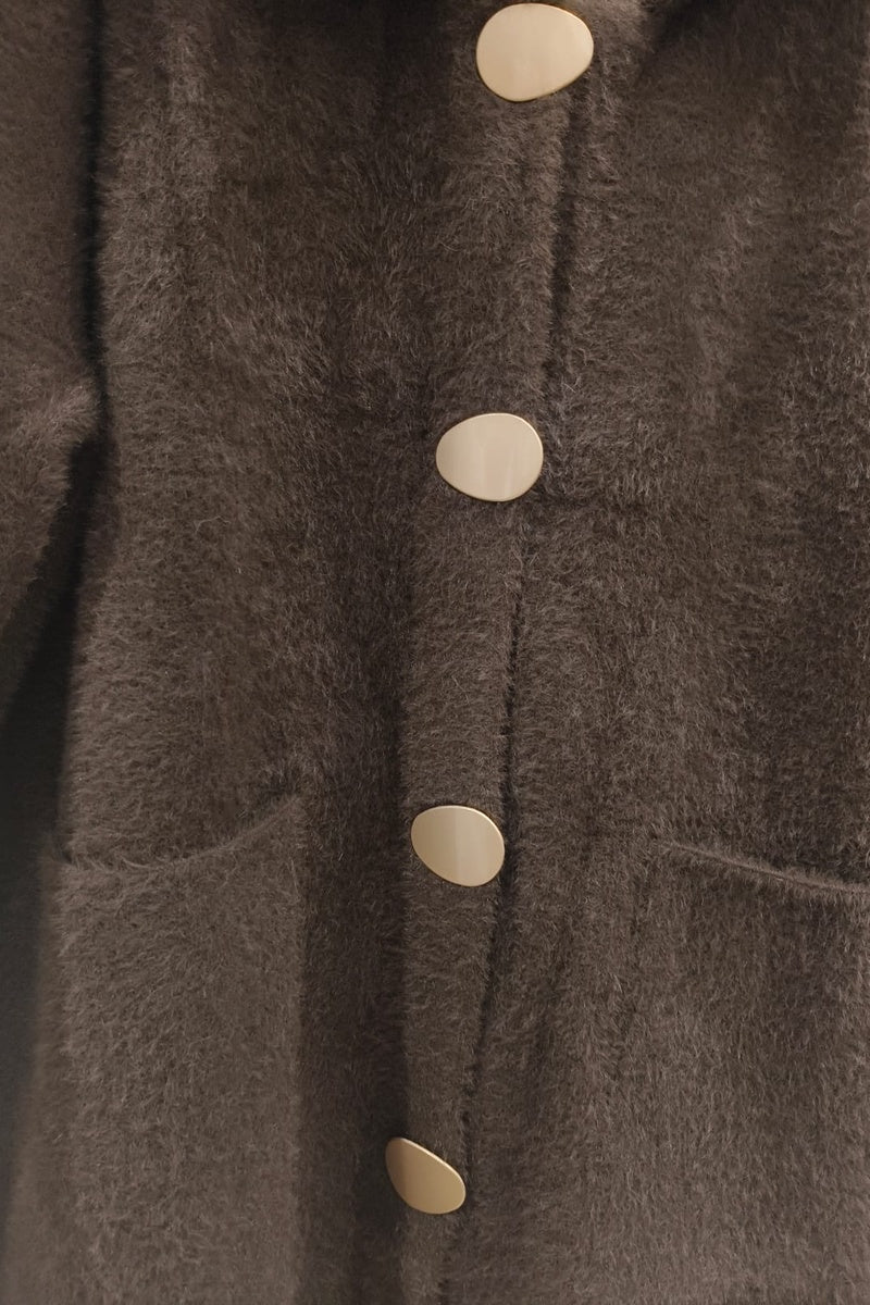 Manteau uni fausse fourrure avec poches