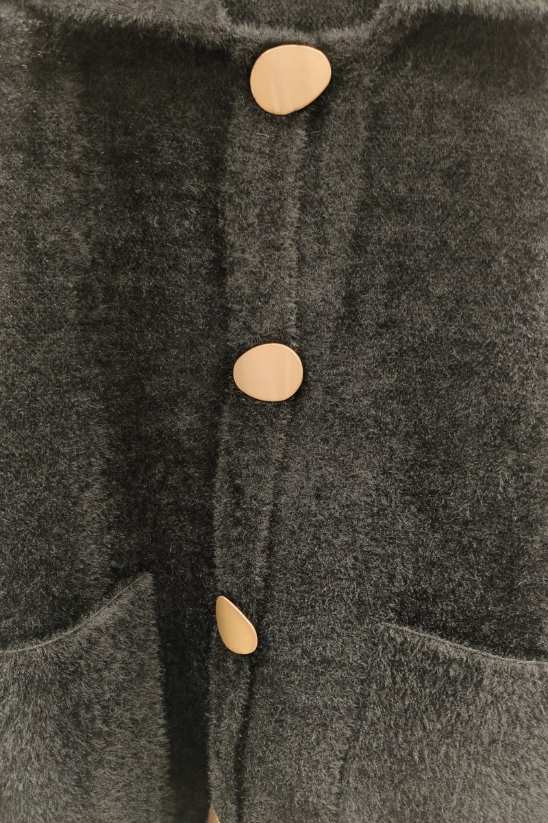 Manteau uni fausse fourrure avec poches